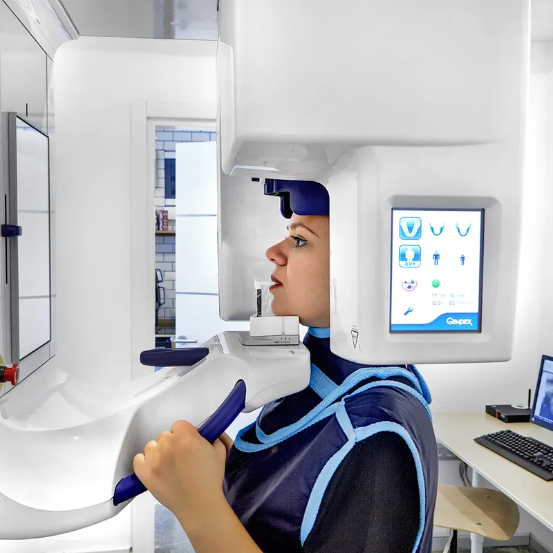 Patient having a panoramic dental X-ray scan at a modern imaging centre