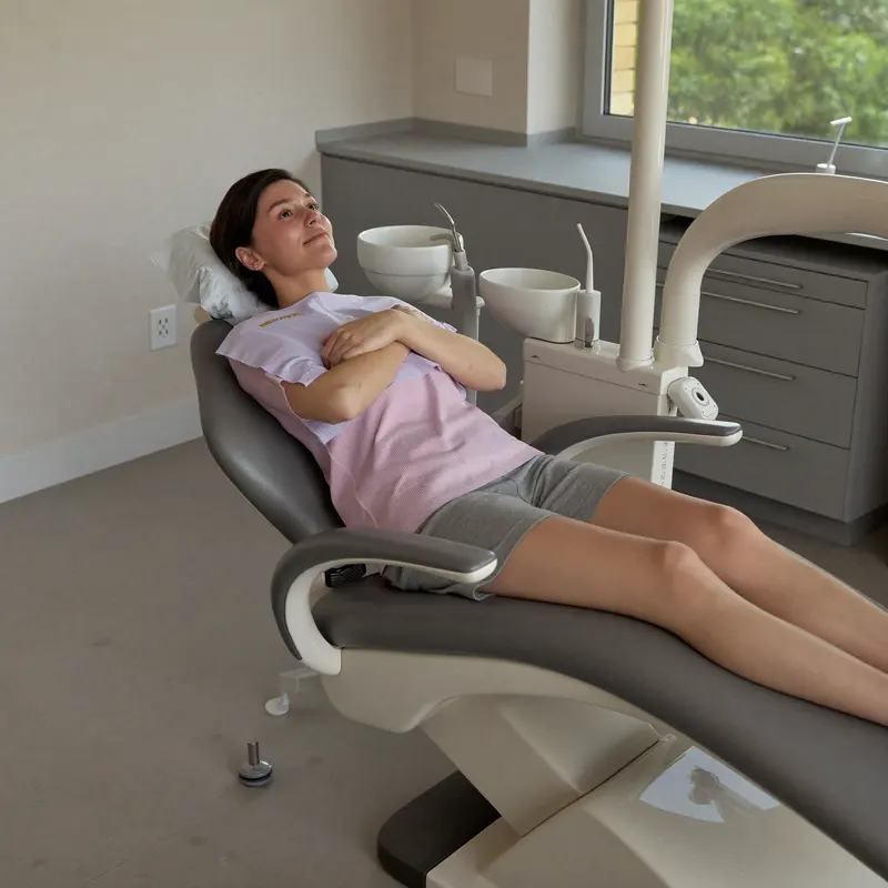 Patient relaxed in a dental chair during a UK follow-up check-up