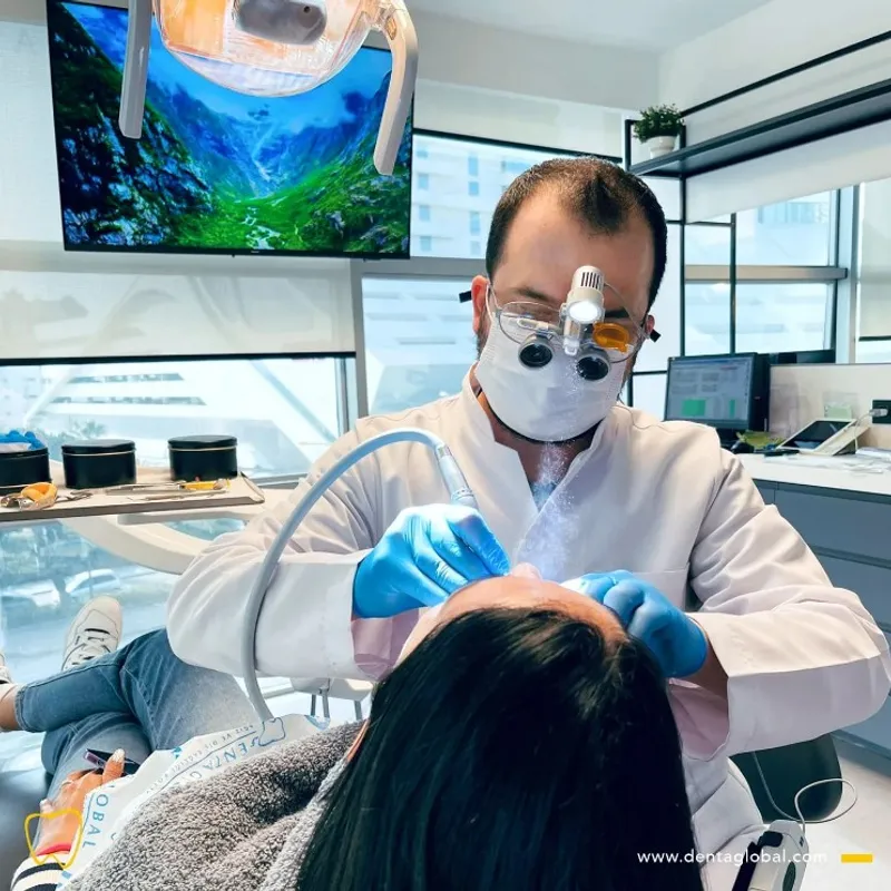 DENTAGLOBAL team member with a patient